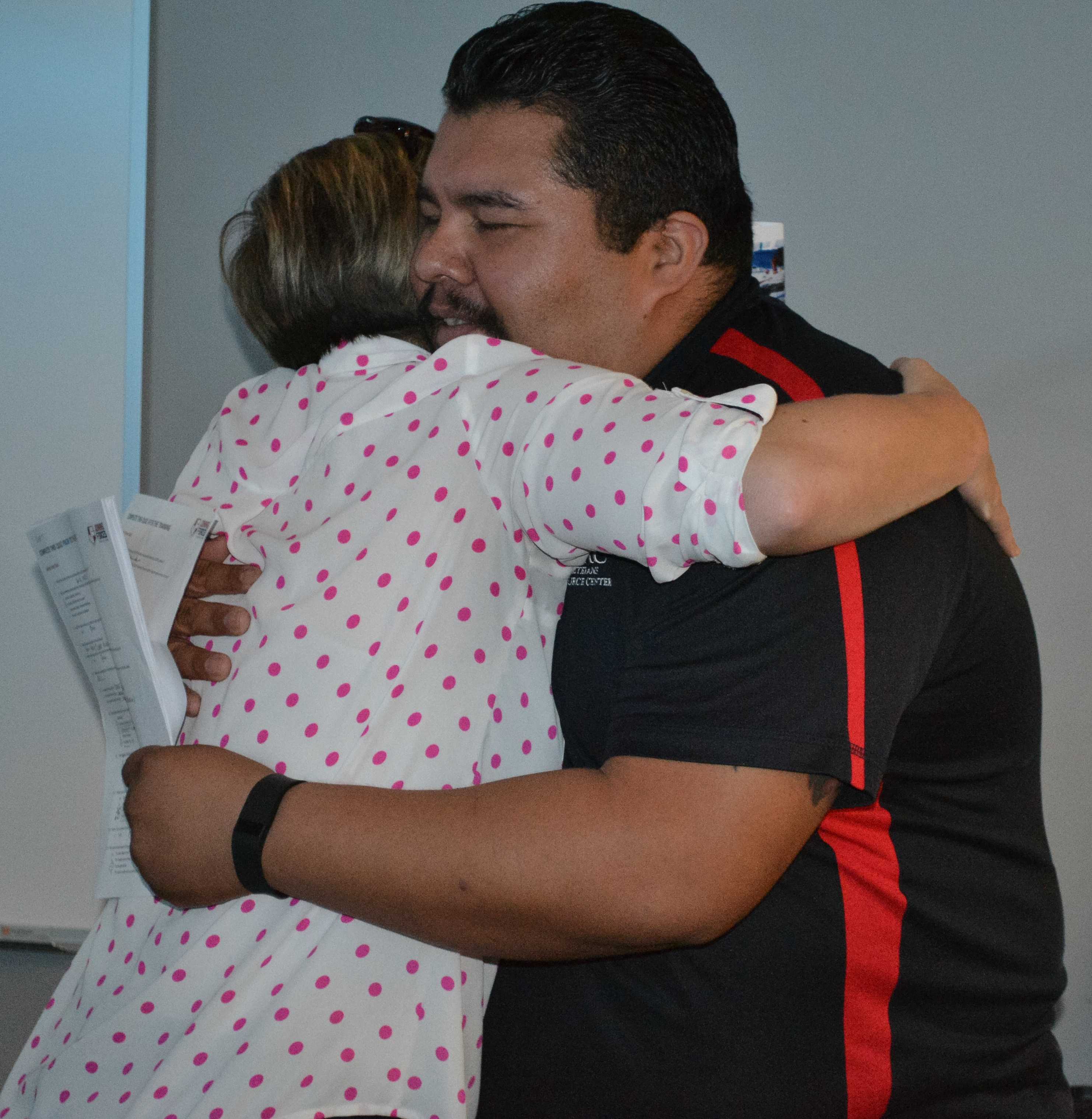 Marine veteran hugs CSUN faculty member