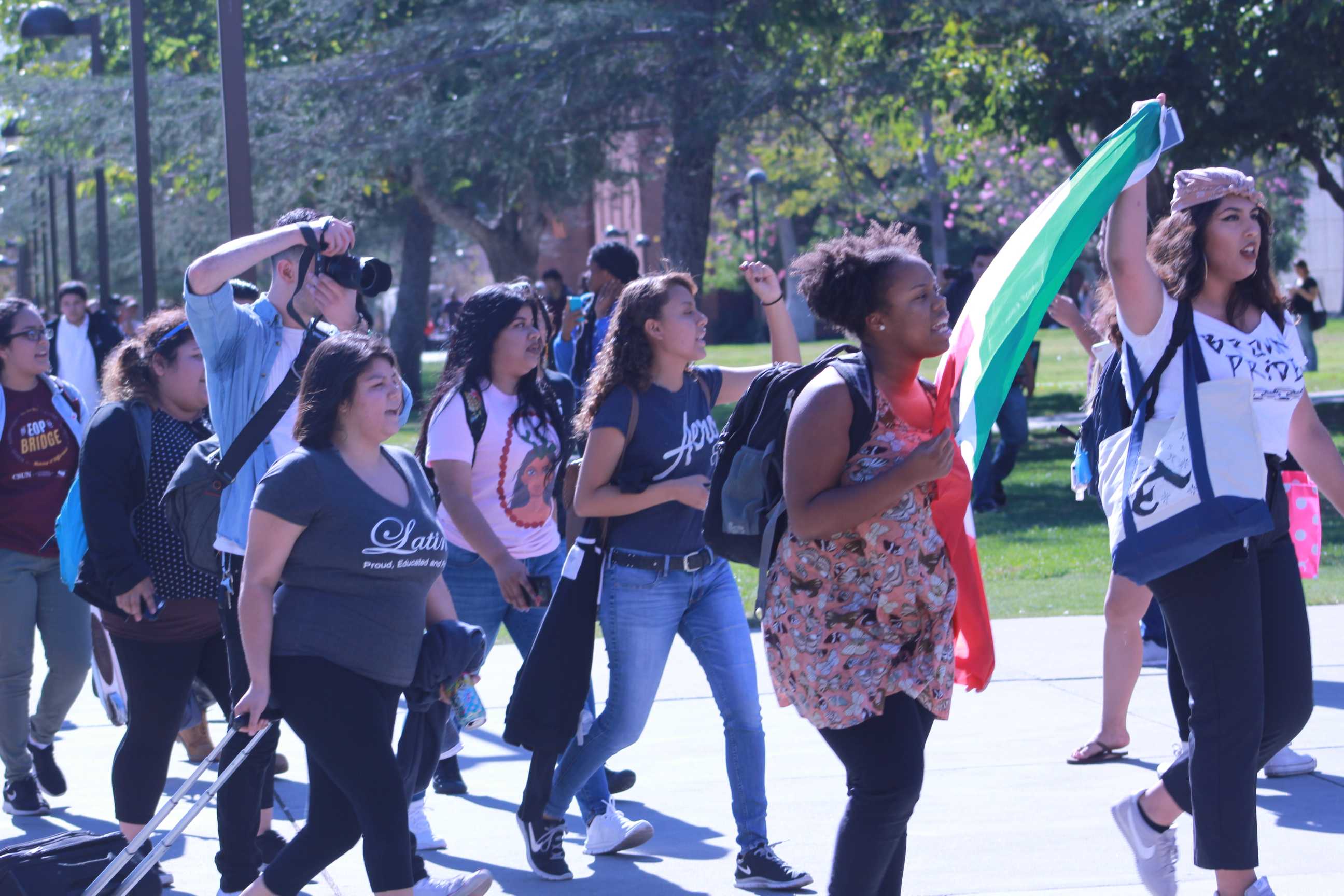 A group of CSUN students walking toward the Oviatt Library to protest the election of Donald Trump on Nov 9, 2016.
(Jasmine Perry / The Sundial)