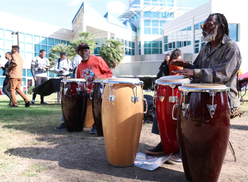 Jai Jei Kabasa (right) and Derf Reklaw providing music during an open house for Africana Studies Week on Oct. 31 outside the matador store.