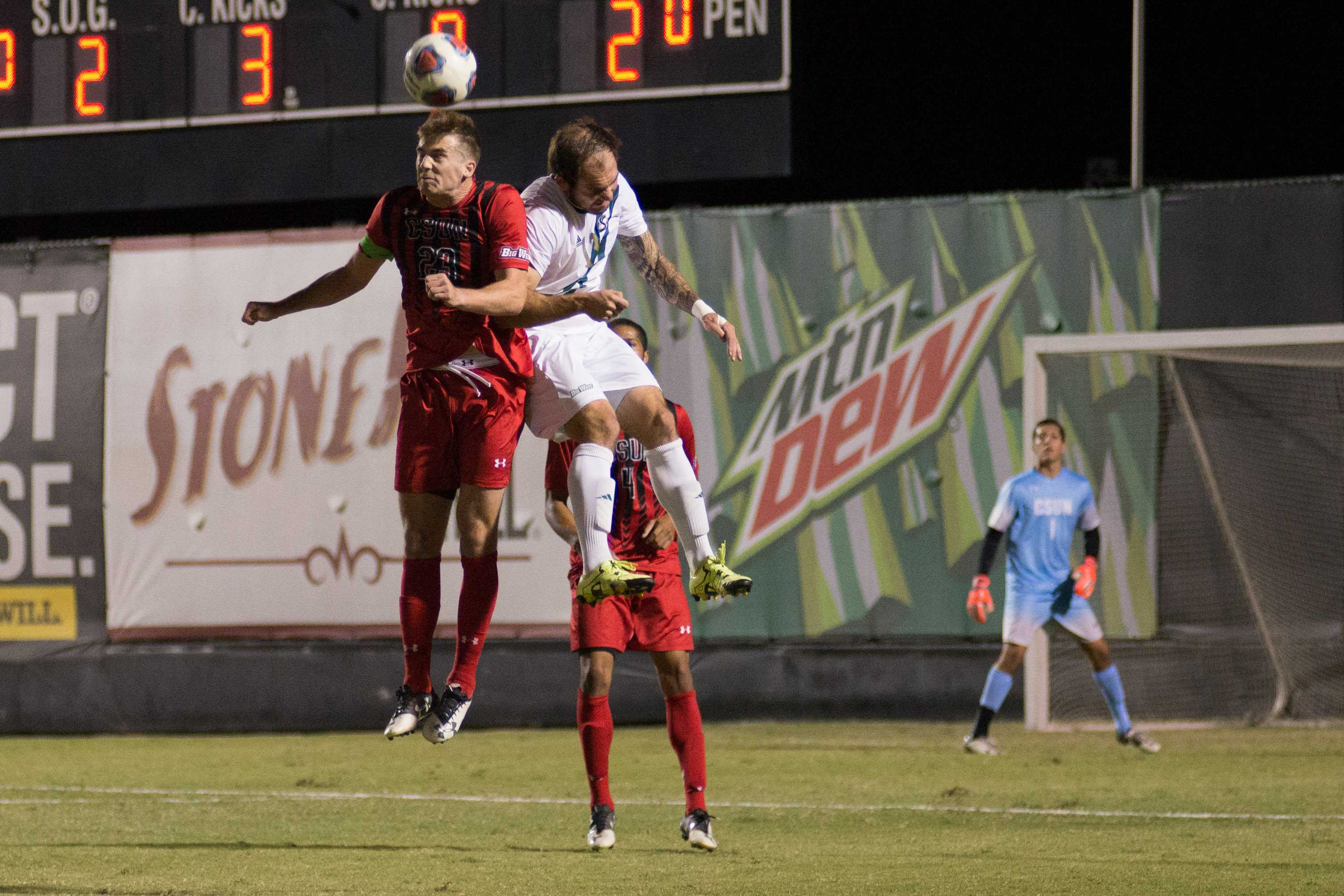 CSUN and CSUF player aim for a header