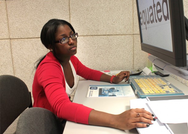 Girl pictured working on a desktop