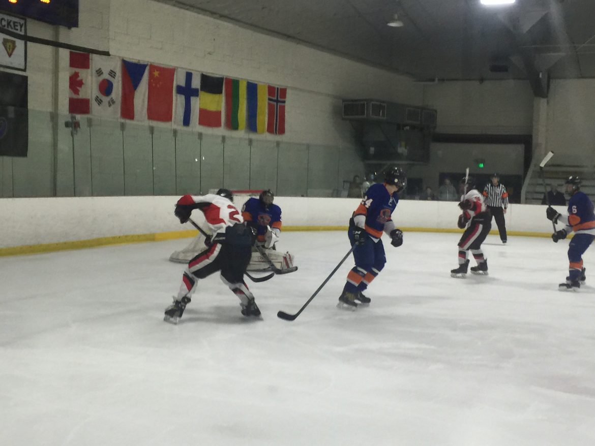 CSUN hockey player scores a goal on the opposing team