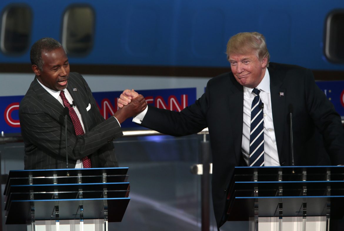 Ben Carson shakes hands with Donald Trump