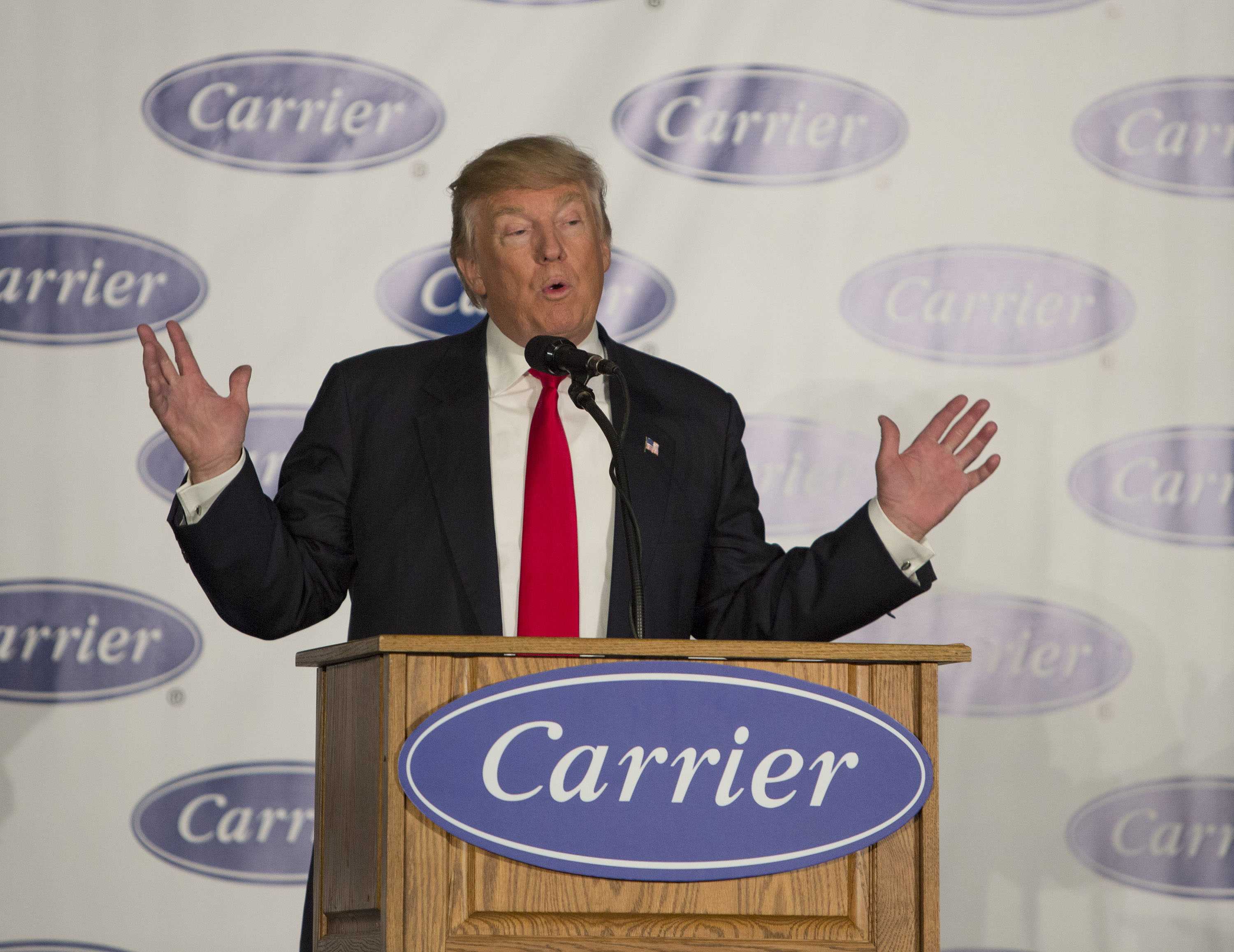 donald trump speaks at the podium for an event hosted by the company carrier