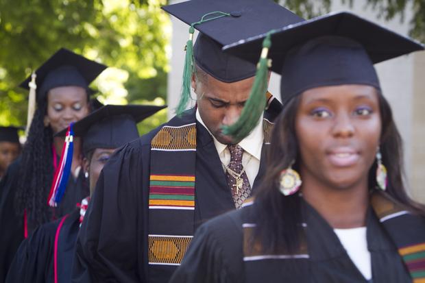 Photo shows students lined up before they graduate