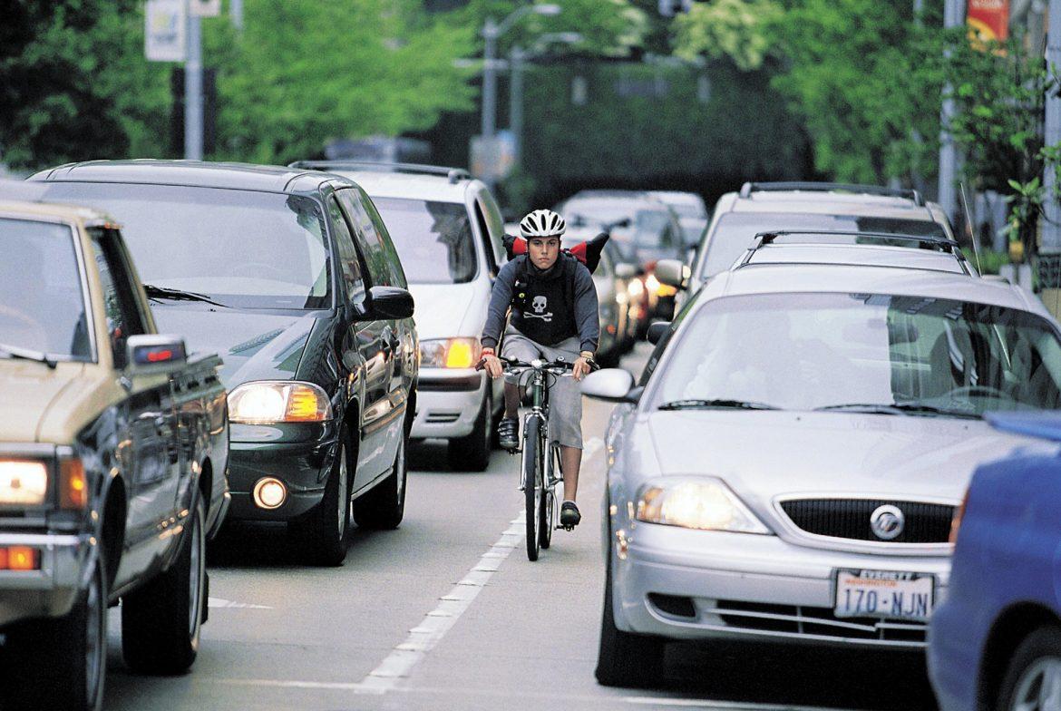 photo shows woman biking to work