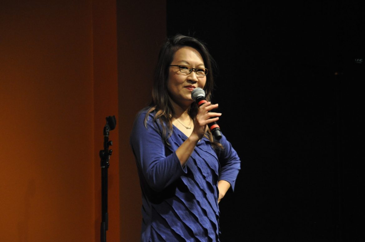 Helen Hong gives a presentation on stage