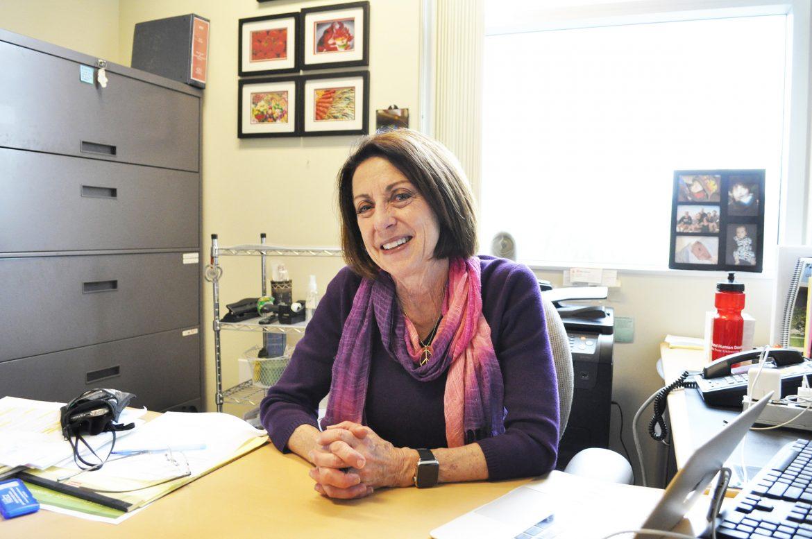 Pictured is Teri Lisagor sitting at her desk