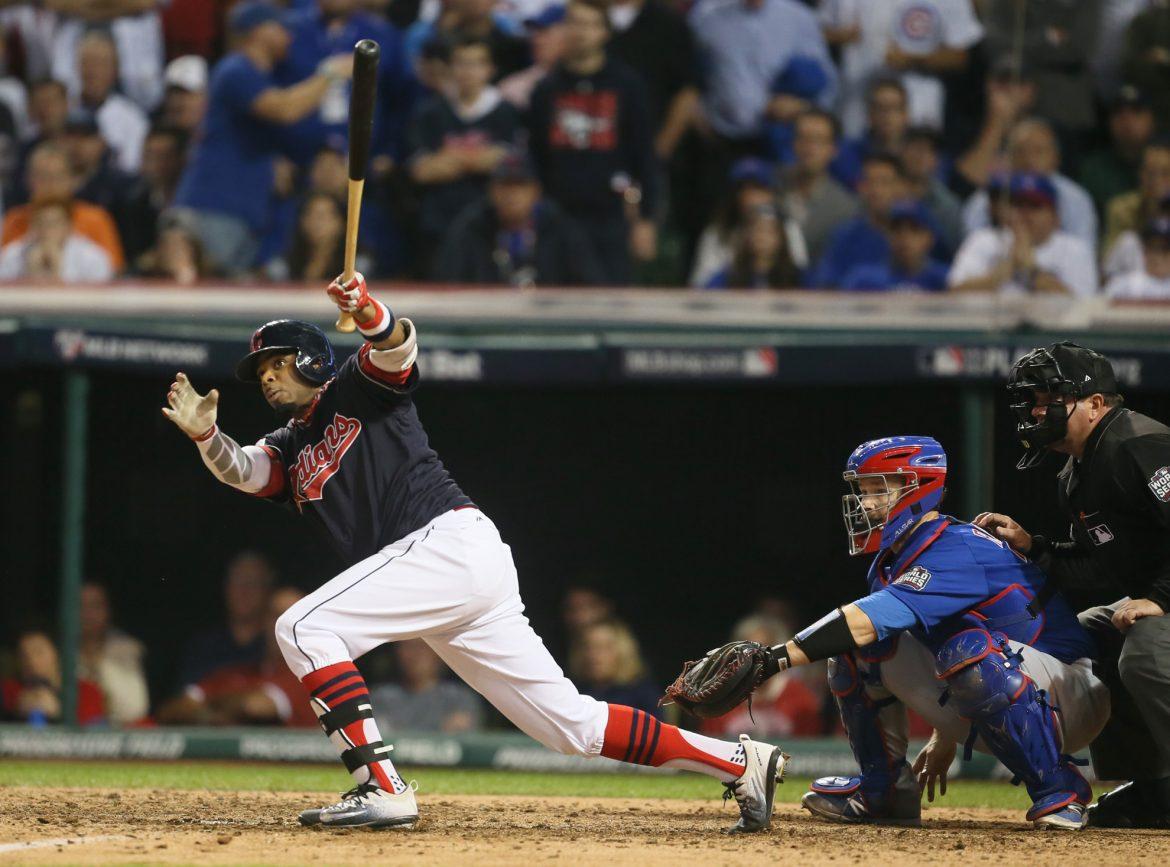The Cleveland Indians' Rajai Davis hits a two-run home run in the sixth inning against the Chicago Cubs during Game 7 of the World Series at Progressive Field in Cleveland on Wednesday, Nov. 2, 2016. (Phil Masturzo/Akron Beacon Journal/TNS)