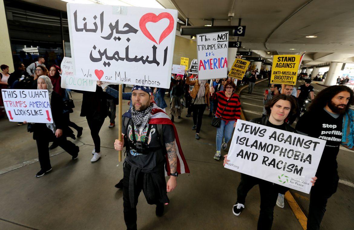 Protestors against the travel ban gather at the Tom Bradley International Terminal at LAX in Los Angeles on Saturday, Feb. 4, 2017. Photo Credit, Luis Sinco/Los Angeles Times/TNS