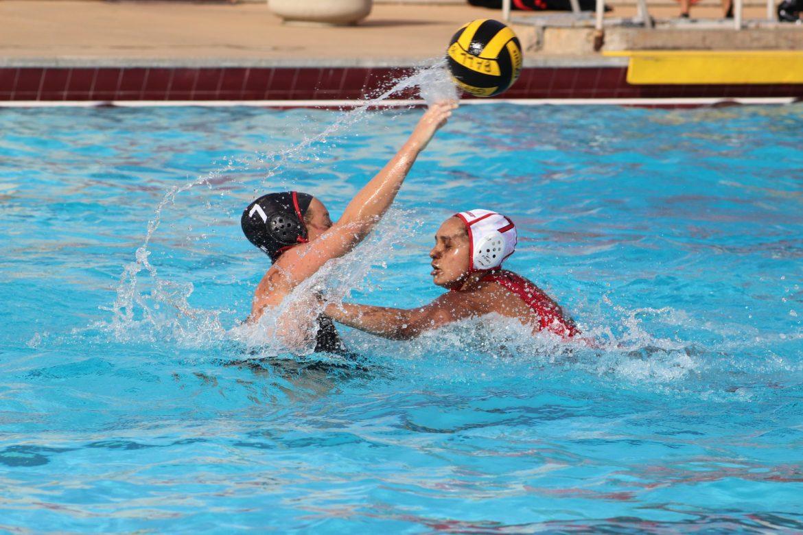 Water polo player throws the ball