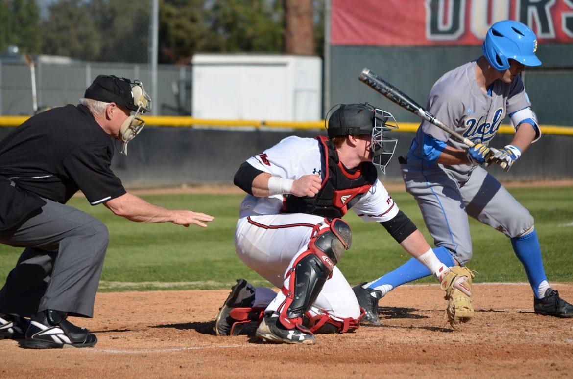 Junior catcher Albee Weiss, #10, digs out a pitch during Tuesday’s game against UCLA on Feb. 28, 2017. Photo credit: Anthony Martinez