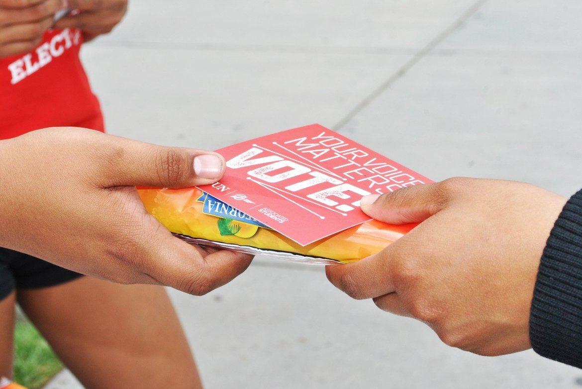 AS committee members stood near the voting stations passing out ice cream and flyers to promote the elections during the April 2016 elections. File Photo: The Sundial
