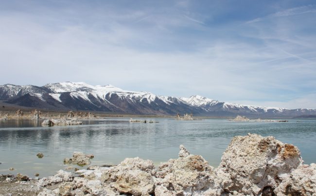 the sierras are pictured next to a large body of water