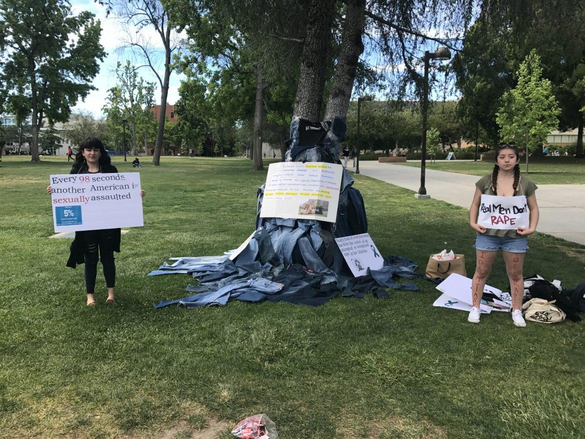 gender and womens studies majors pose with signs that say every 98 seconds another americanis sexually assaulted and real men dont rape