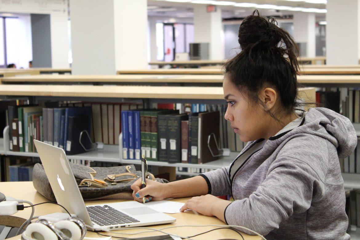 Araceli Uribe pictured studying in the library