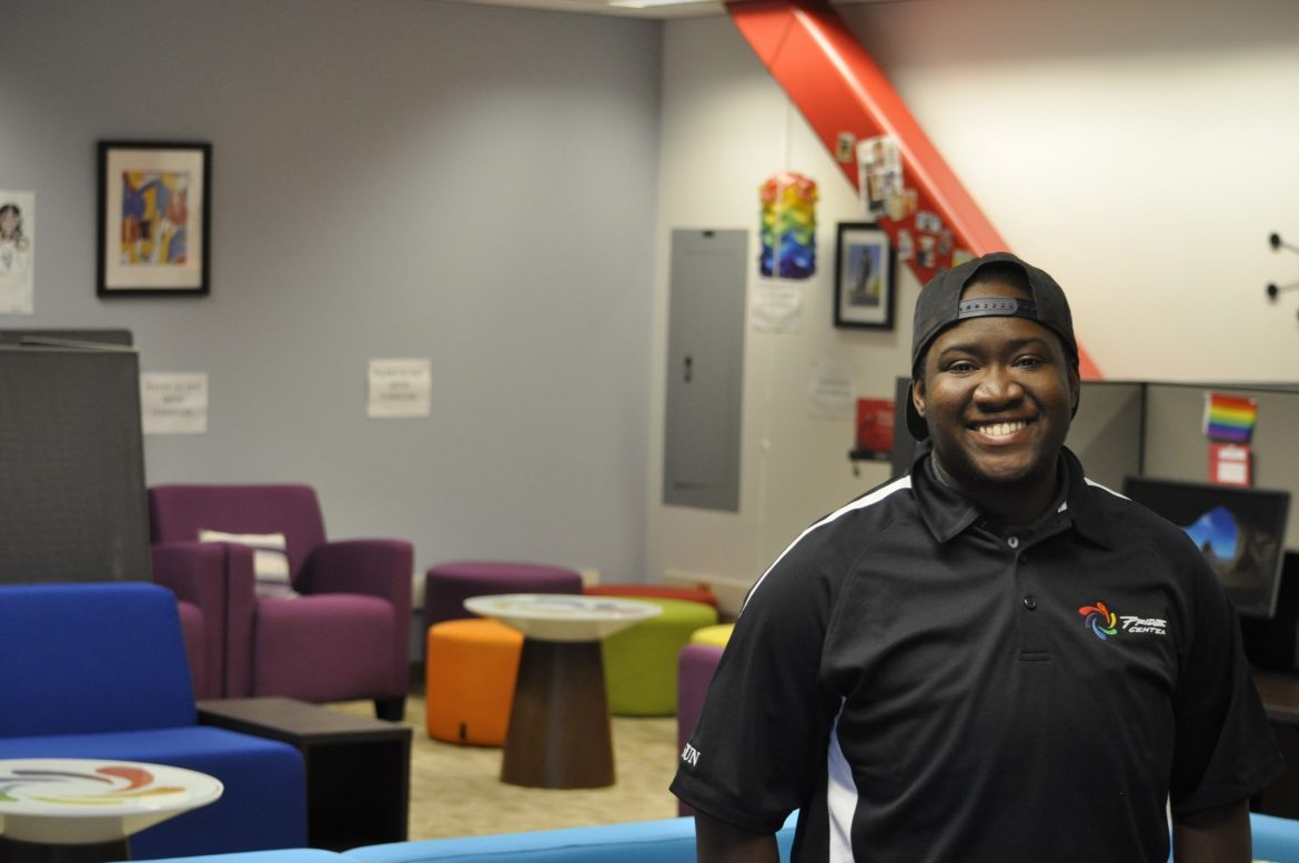 Tyler Neroes pictured standing in the pride center, smiling