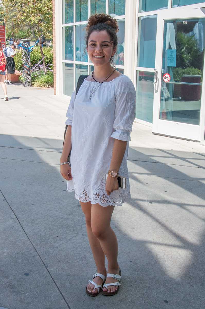 woman pictured wearing an all white dress