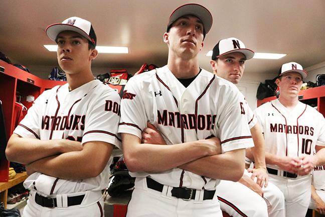 Members of the baseball team listen to their coach give them advice about how to deal with the media during baseball Media Day in the locker room on Tuesday, Jan. 14, 2016. Nikolas Samuels/CSUN