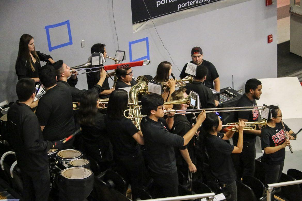 band performing all wearing black