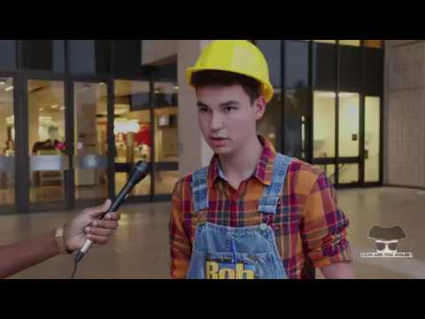 man dressed as Bob The Builder being interviewed