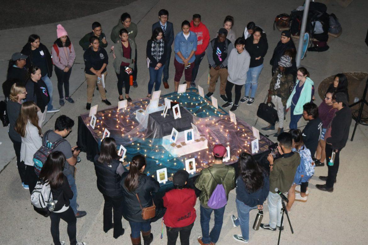 students stand around square alter