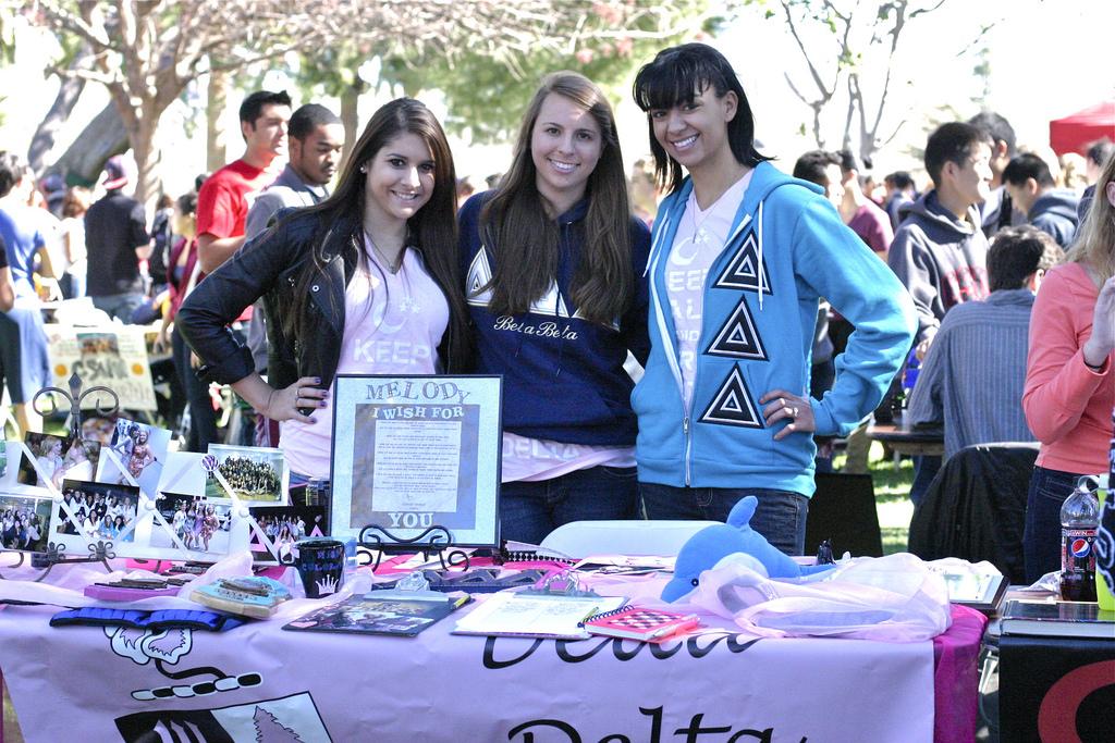 Promoting their sorority, Delta Delta Delta, Juliet Wren-Jarvis (political science), Katie Bariog (liberal studies) and Anamarie Jones (management) pose by their booth at Meet the Clubs. (Sundial File Photo, 2012)