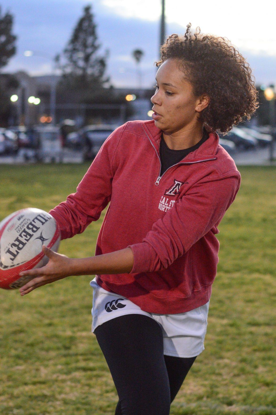 womans rugby player in action