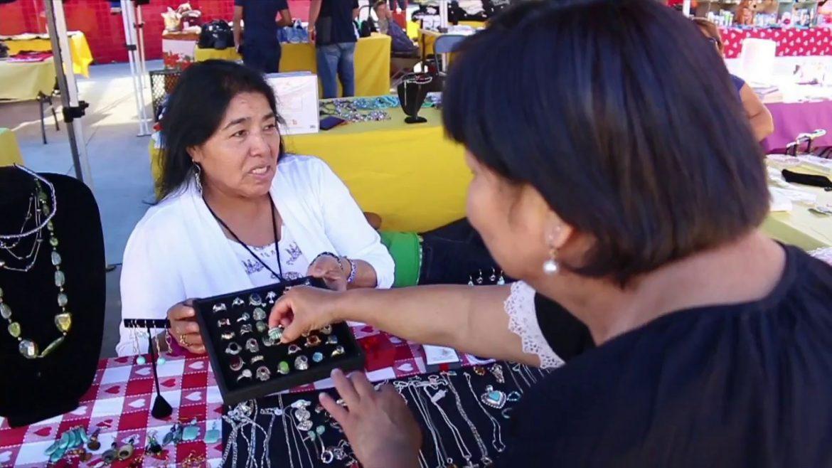 two women present their jewelry they have for sale