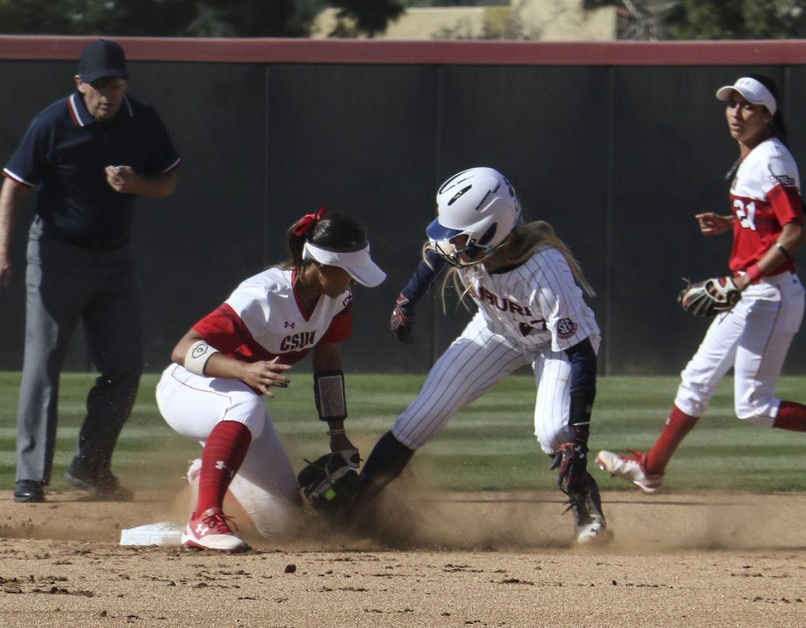 CSUN softball player tags out opponent as they collide on the base