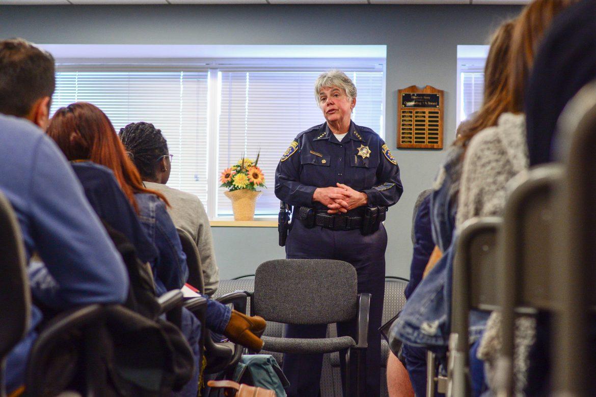 woman police officer speaking to a group of people