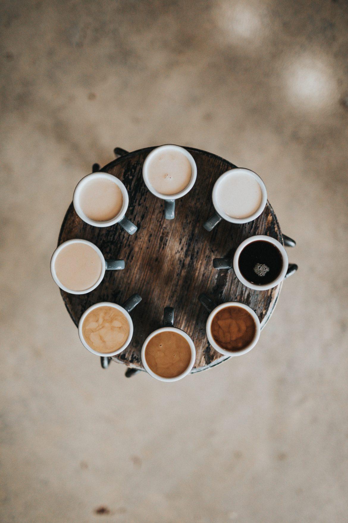 coffee at different shade ranges on a brown circular table