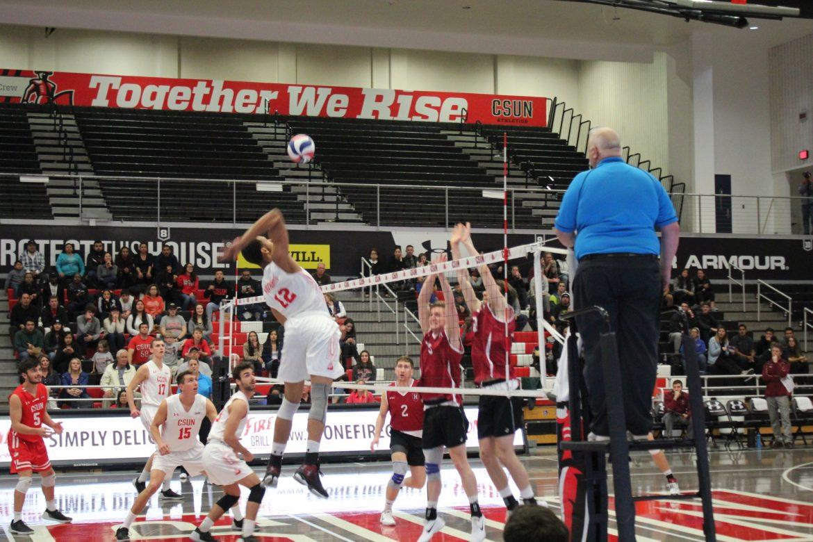 CSUN mens volleyball goes to spike the ball on the opposing team