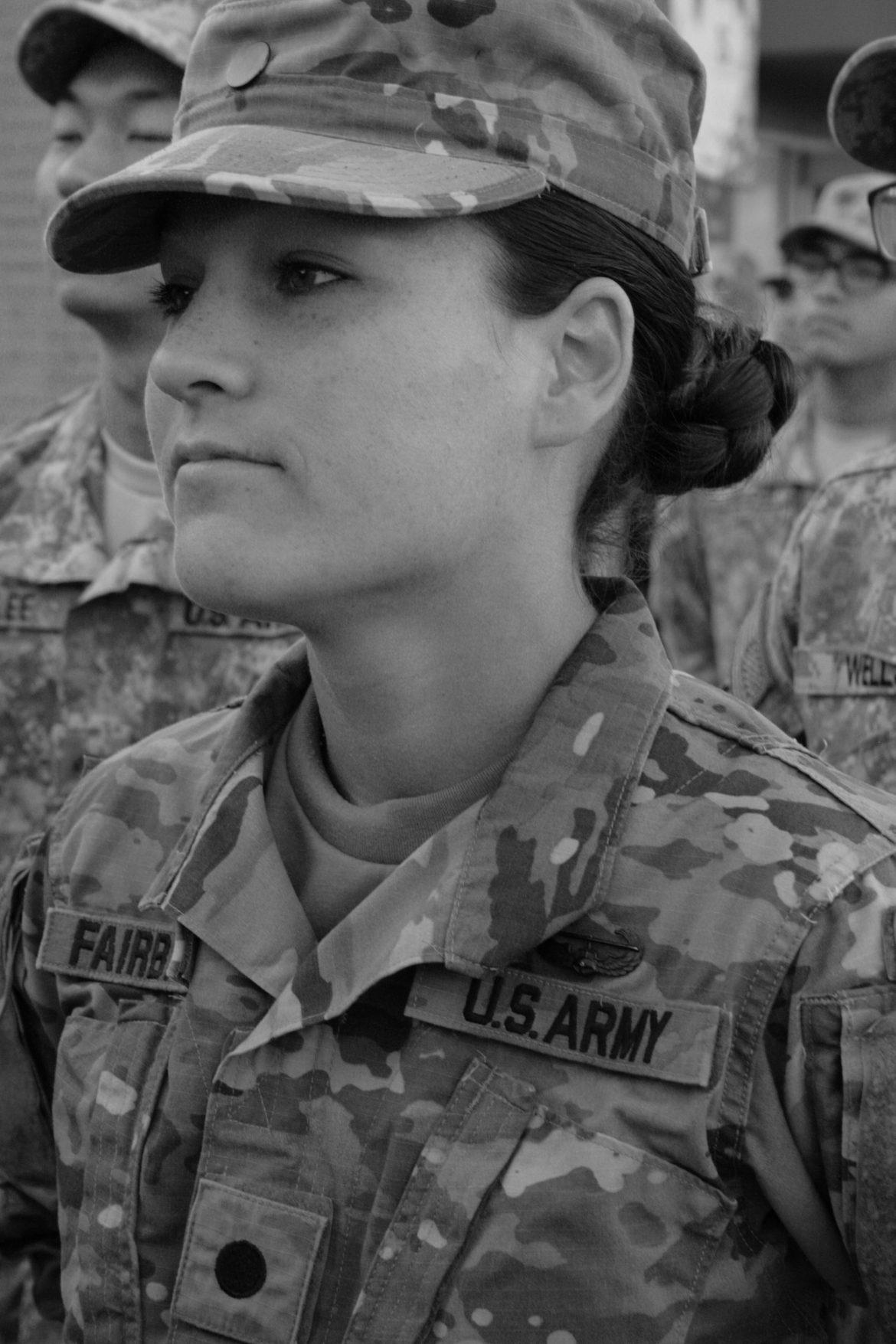 woman dressed in army uniform looking serious