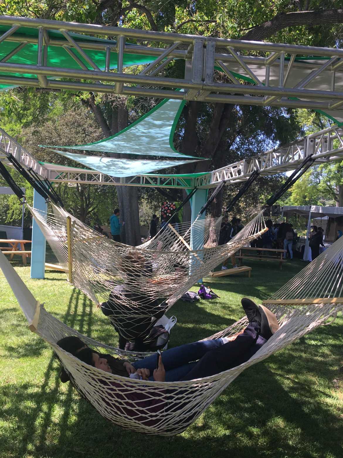 students lay in hammocks