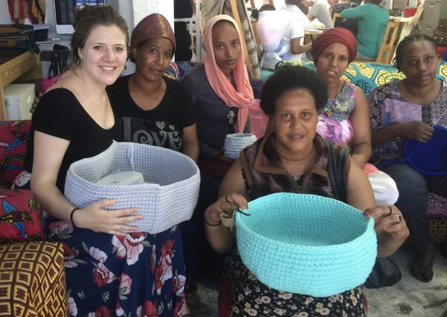 women holding colorful baskets