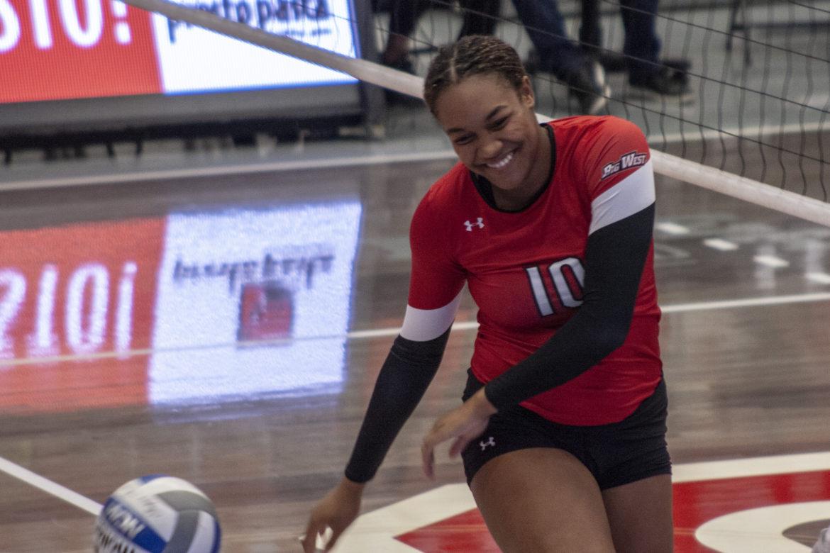 Middle blocker Morgan Salone laughing one off at the net. Photo credit: Trevor Sena