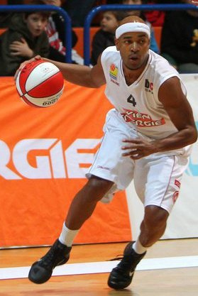 An African American basketball player on the court