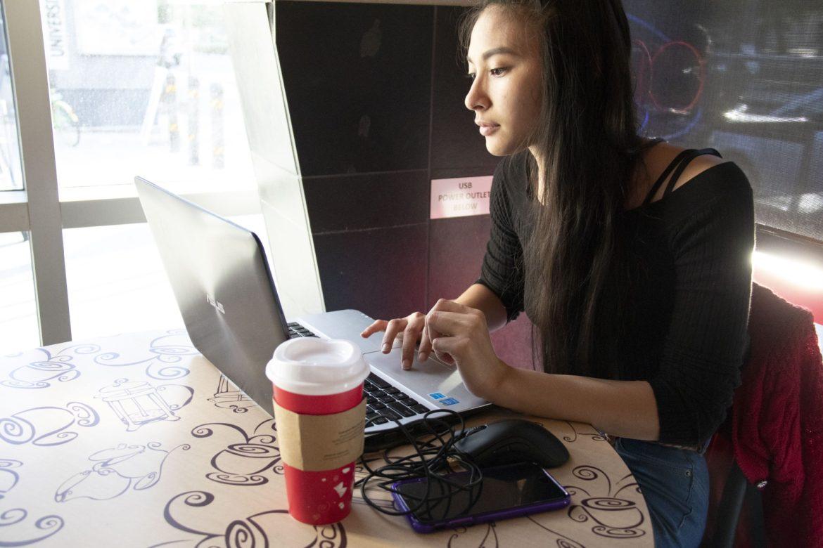A female student using a laptop