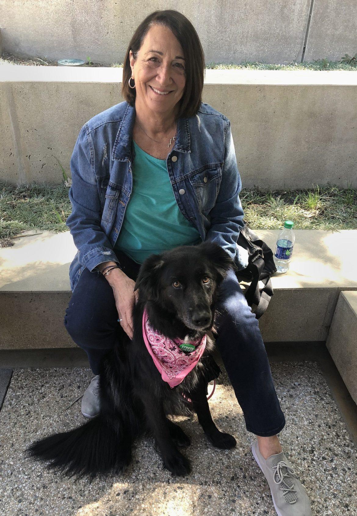 A therapy dog handler with her dog