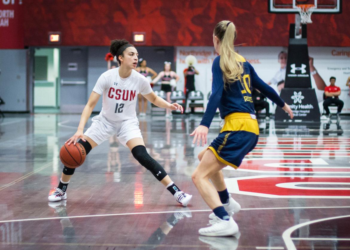 Sophomore Meghann Henderson surveys the court during the win over UC Irvine on Wednesday. The Matador guard had one of her best nights of the season, recording 11 points, four assists and five rebounds in 34 minutes off the bench. Photo credit: John Hernandez