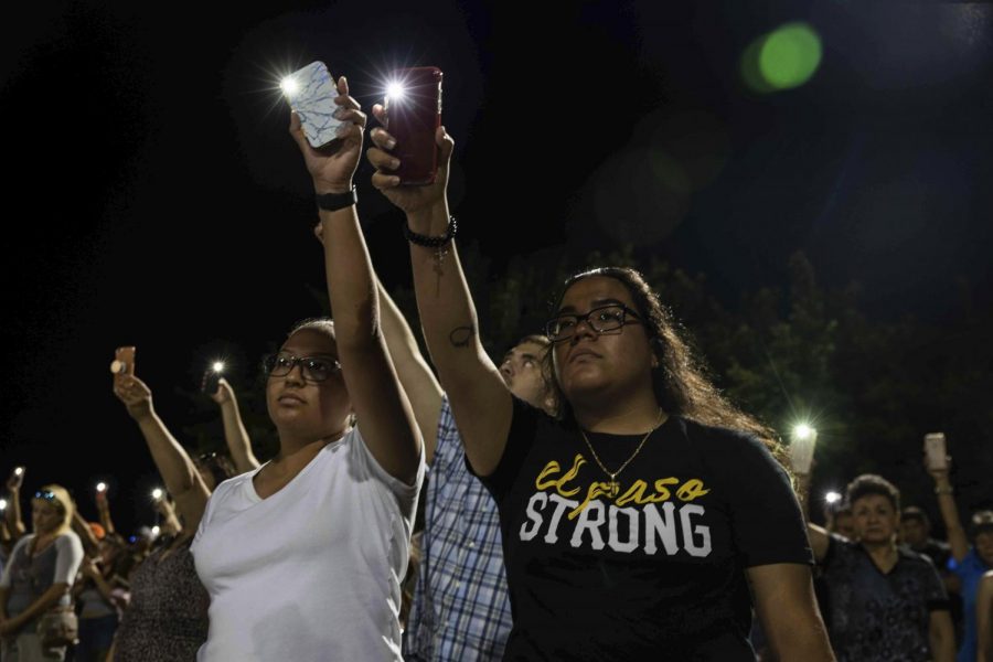Karina Cardoso and Linda Nevarez hold their cellphone flashlights up during an Aug. 4 vigil in El Paso for the victims of the previous day's shooting at a Walmart. Gov. Greg Abbott will convene on Thursday morning the first meeting of the Texas Safety Commission, which Abbott created in the wake of the El Paso shooting. [LOLA GOMEZ / AMERICAN-STATESMAN]