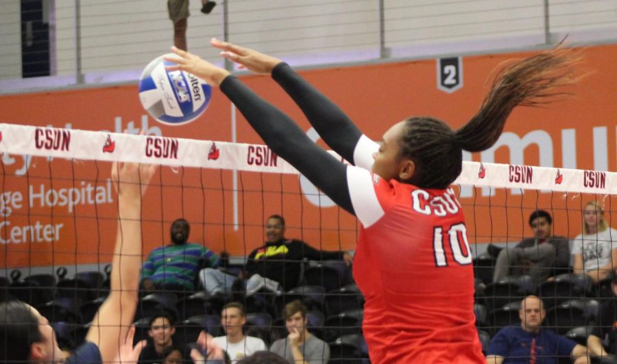 Morgan Salone blocks a ball against Cal State Fullerton in the Matadome on Oct. 19 Photo credit: Serena Christie