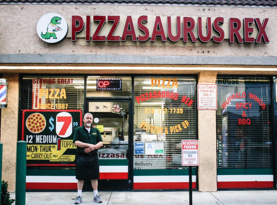 man standing in front of store