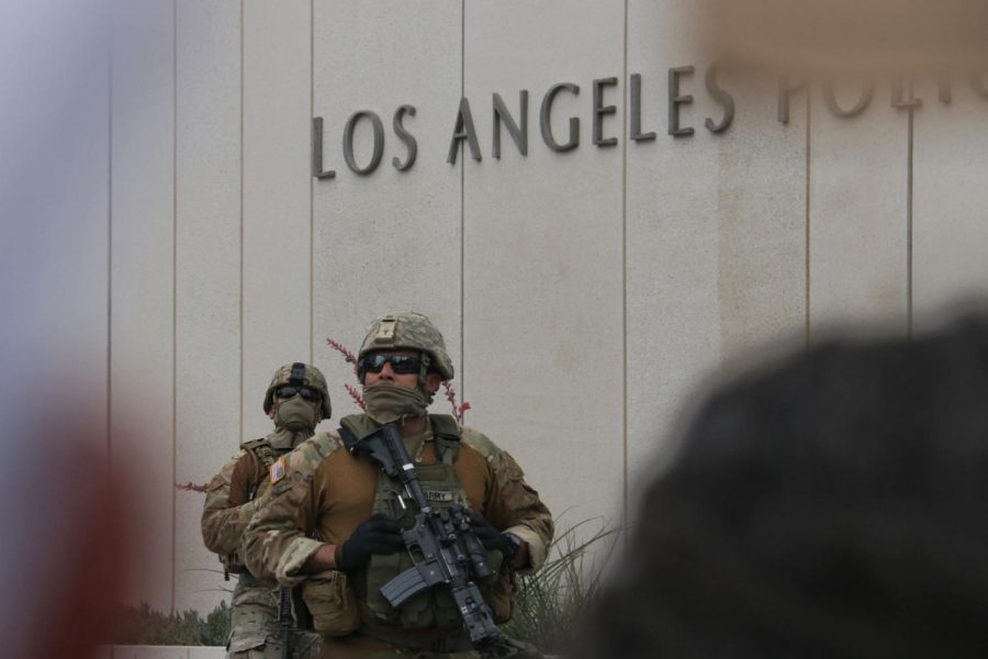 The National Guard stands outside of the LAPD headquarters in downtown L.A.