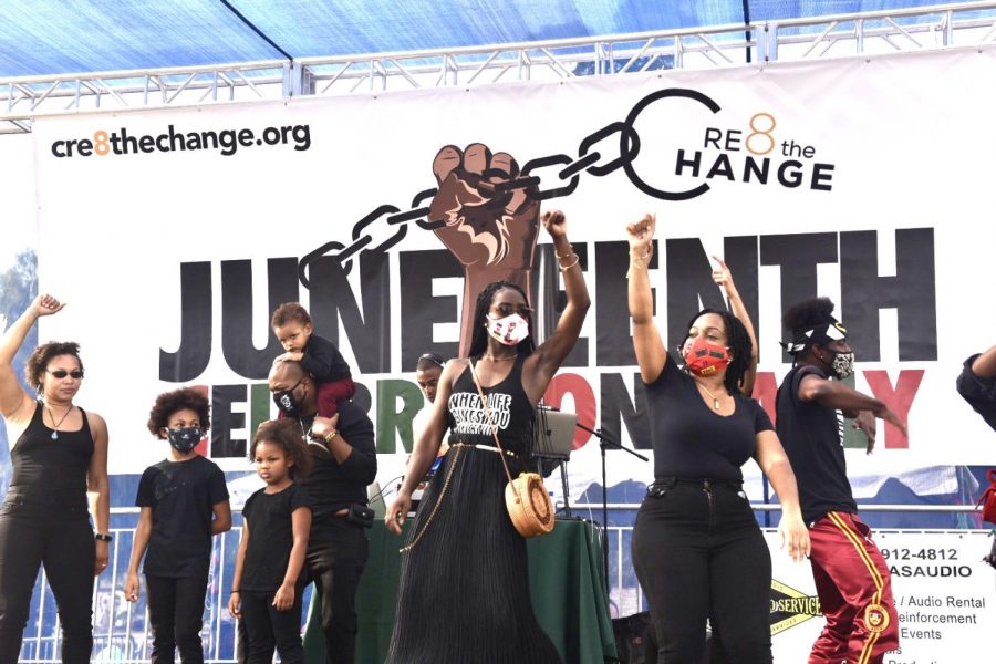 Families and Cre8 The Change dancers enjoy music on stage during the Juneteenth Celebration Rally in Van Nuys Sherman Oaks Memorial War Park on Friday, June 19, 2020.