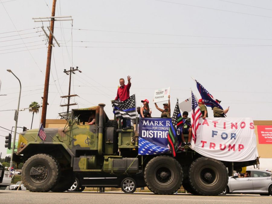 Mark Reed, a candidate for Californias 30th Congressional District, poses atop a vehicle during a pro-Trump caravan on Sunday, Sept. 13, 2020.