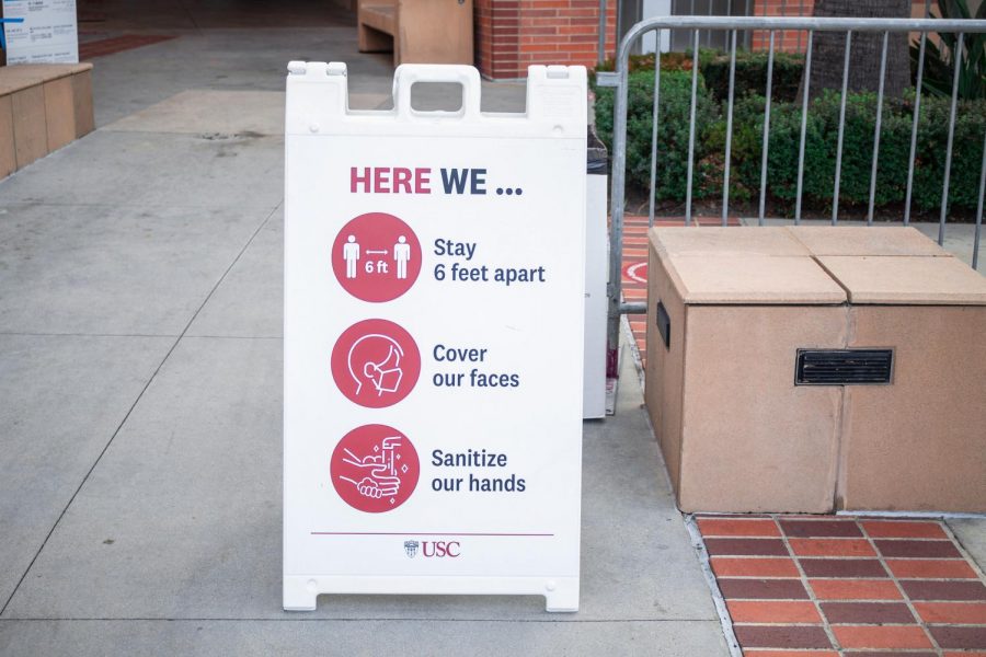COVID-19 rules  displayed outside of the USC Galen Center in Los Angeles, Calif. on Tuesday, Nov. 3, 2020