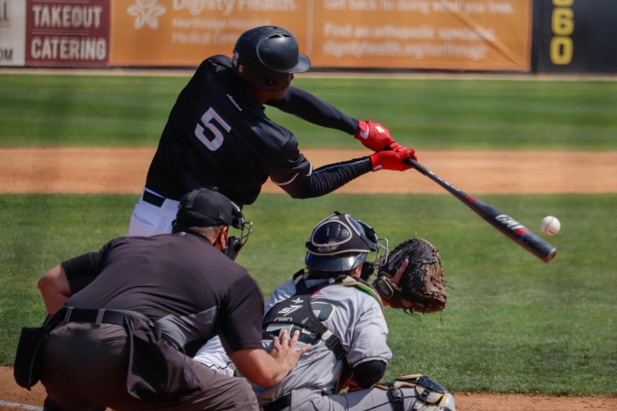 Center fielder Denzel Clarke hits an opposite field homer in the second inning to give the Matadors a 4-2 lead in a game against Cal Poly at Matador Field in Northridge, Calif., on Saturday, March 20, 2021. The Matadors picked up a 13-10 win in their first competitive game in 377 days.