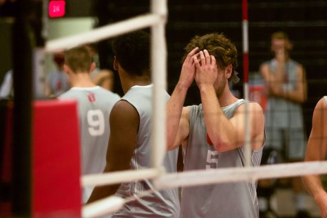 CSUN setter Kyle Merchen with his face in his hands after the Hawaii Rainbow Warriors score a point during their volleyball match held in the Matadome in Northridge, Calif., on Saturday, April 10, 2021.